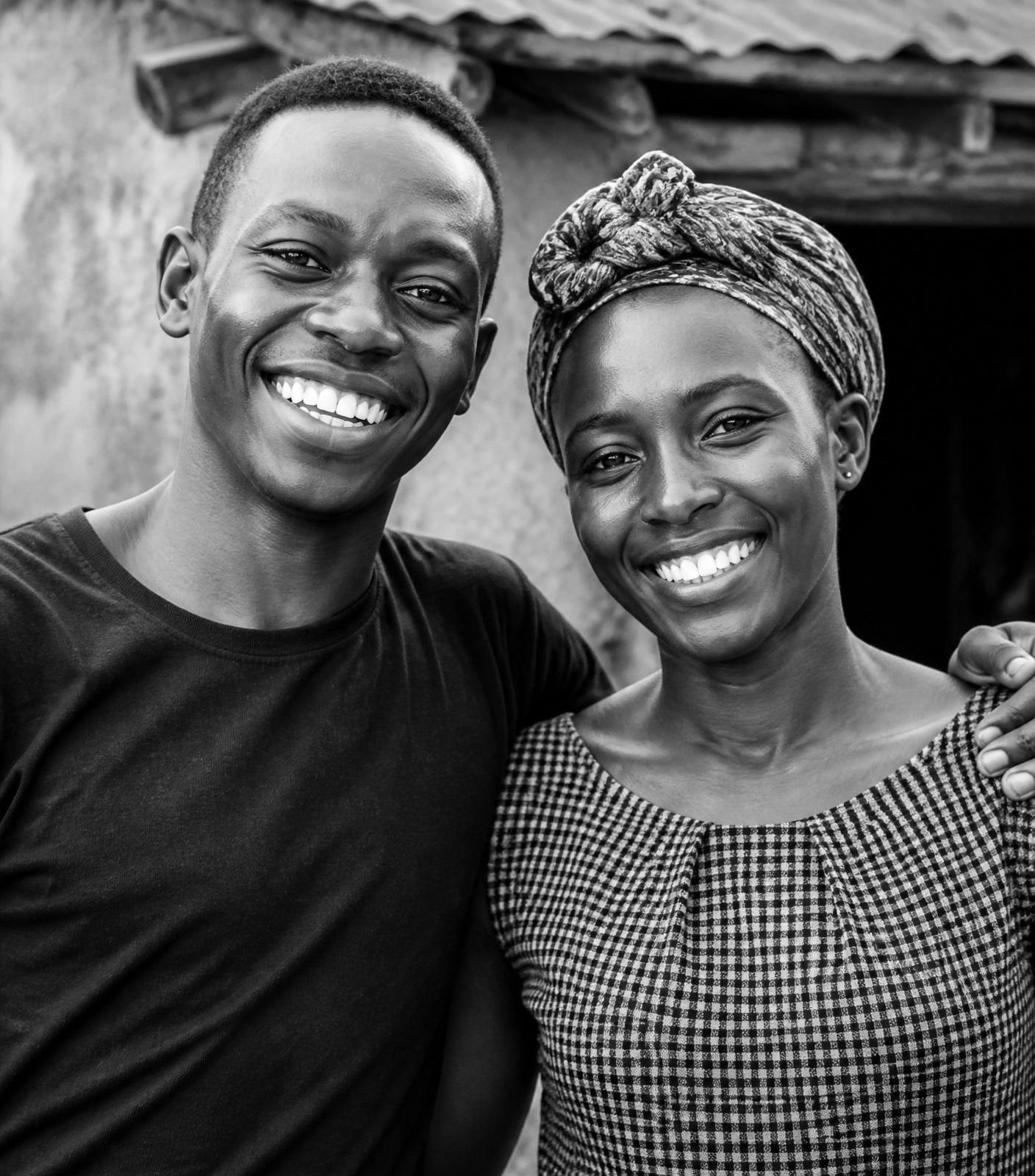 A young Kenyan man and woman smiling with hope and dignity